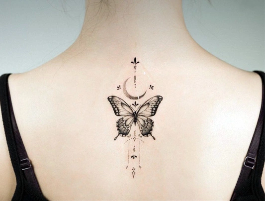 Fine line butterfly and moon back tattoo by Maral in Richmond Hill