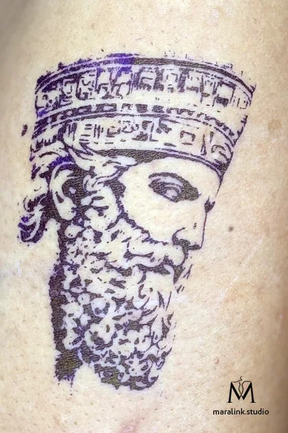 Freshly applied stencil linework of a Persian king tattoo by Maral in Richmond Hill